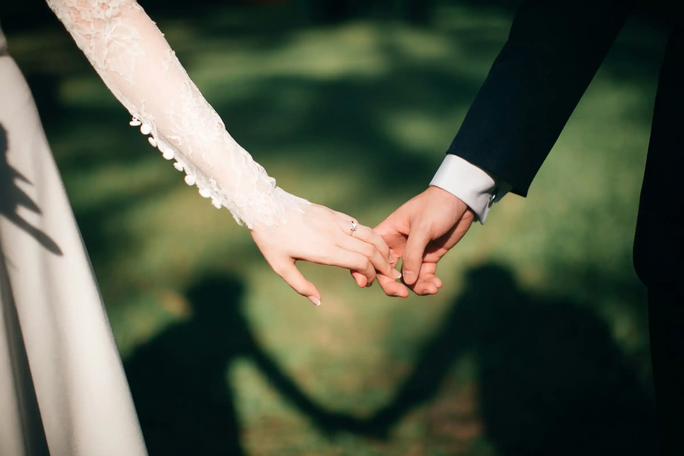A couple holding hands, seen close up
